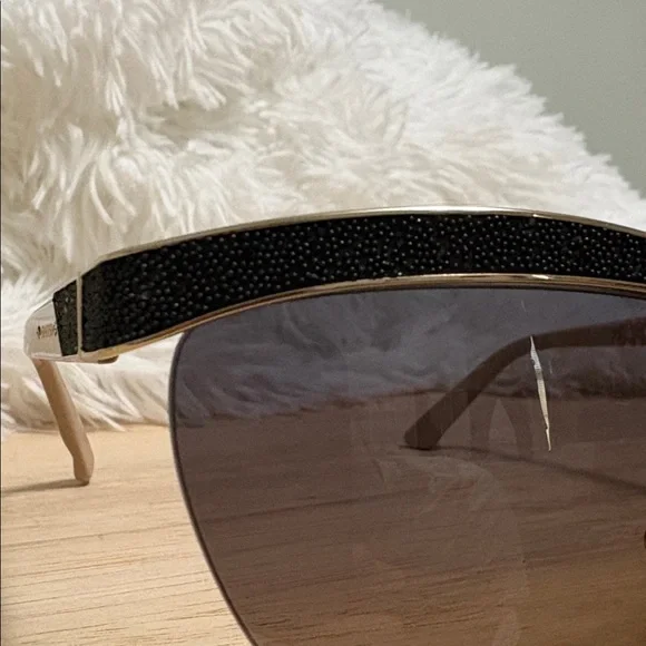 SWAROVSKI: Elegant Black and Gold Sunglasses